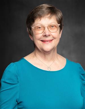 Portrait image of Barb Mozdzen.